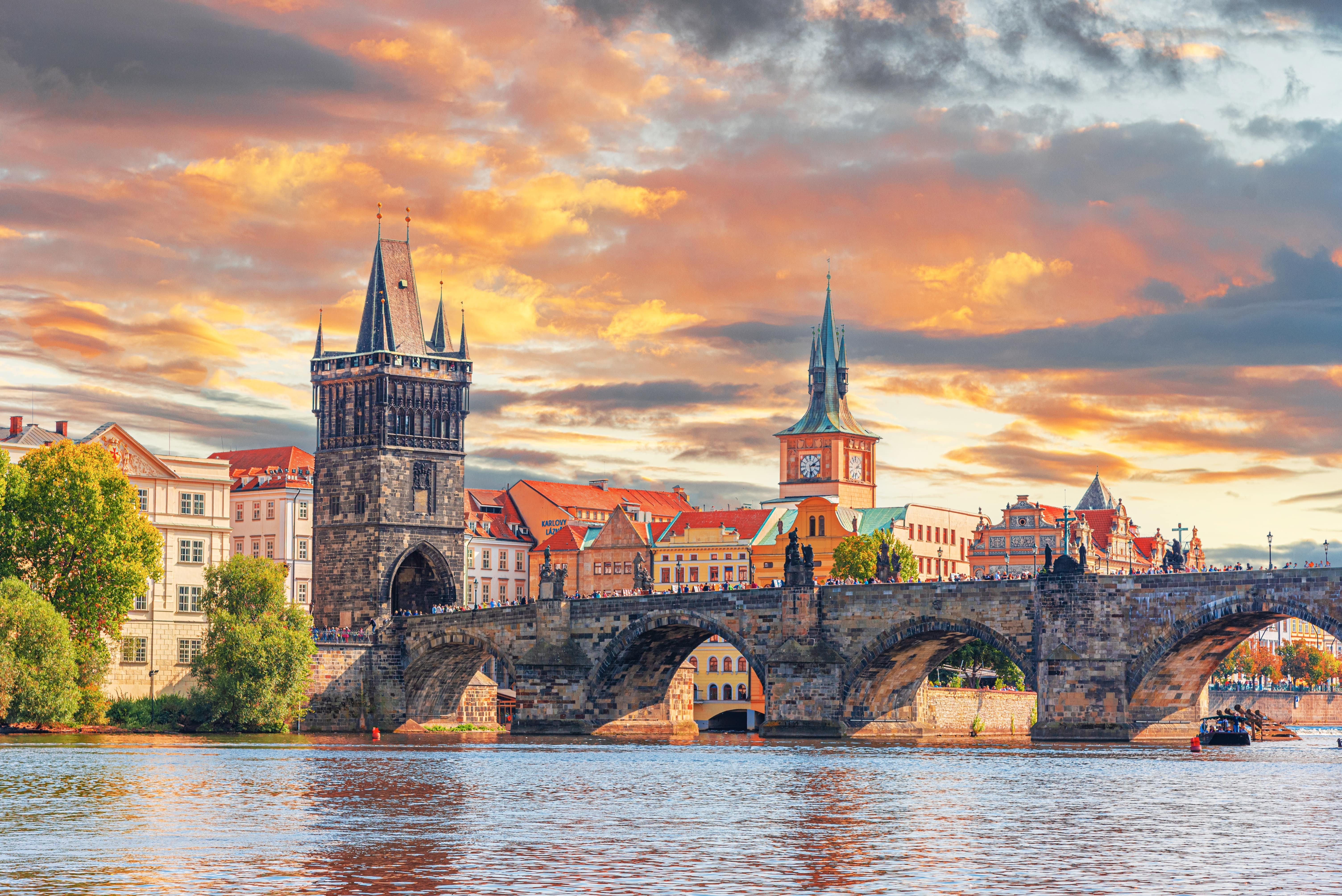 harles bridge, Czech Republic. Scenic aerial sunset on the architecture of the Old Town Pier and Charles Bridge over the Vltava River in Prague, Czech Republic.